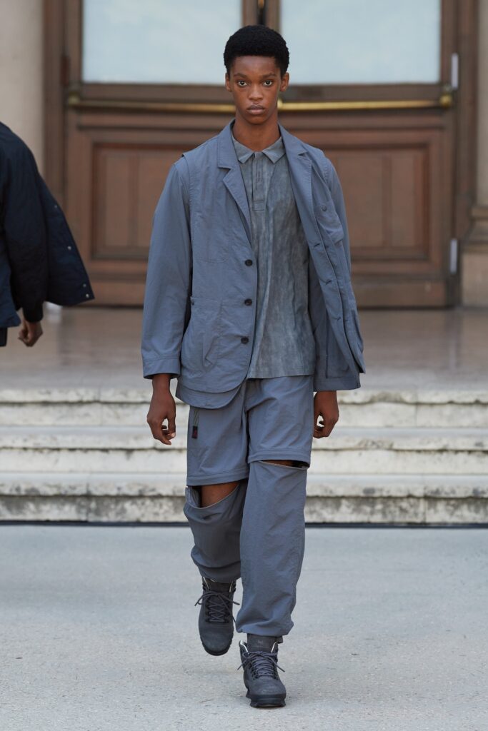 A relaxed gray cotton jacket with long sleeves and a collared design, paired with matching pants.