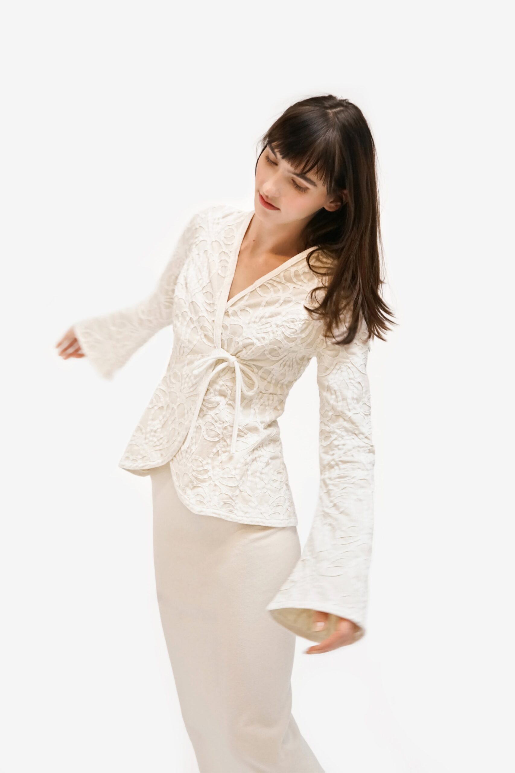 white lace blouse and beige skirt