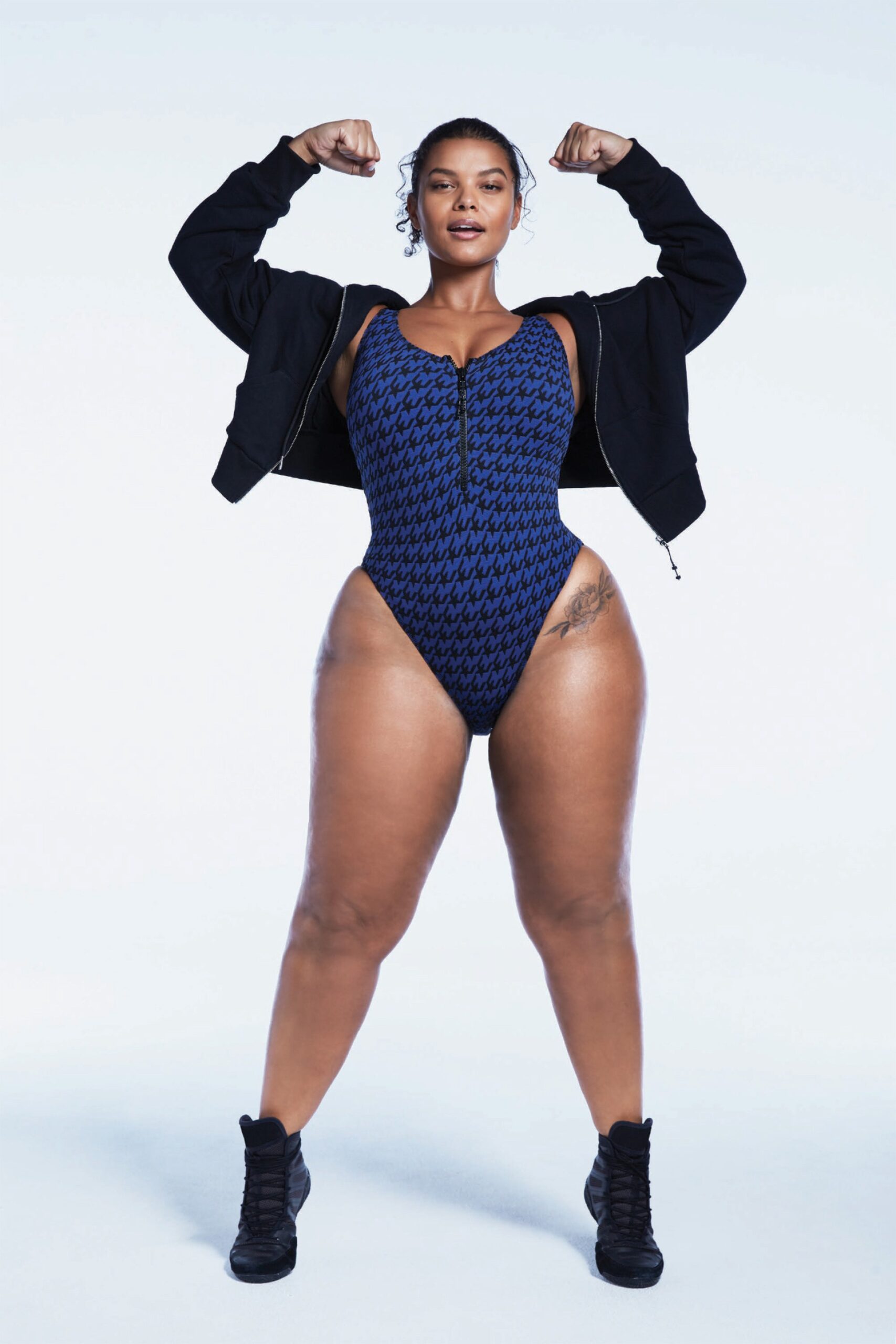 blue neoprene swimsuit with black jacket