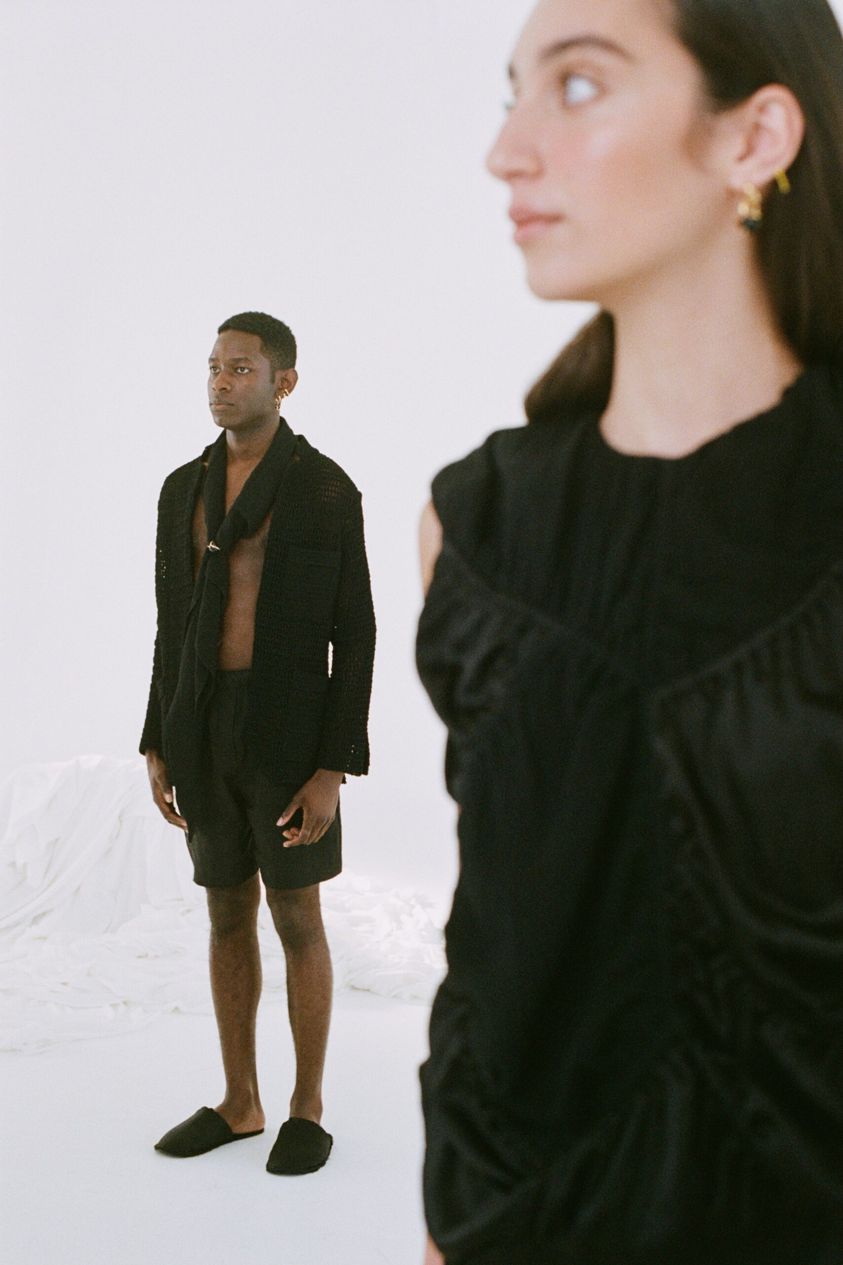 black fitted top and relaxed shorts