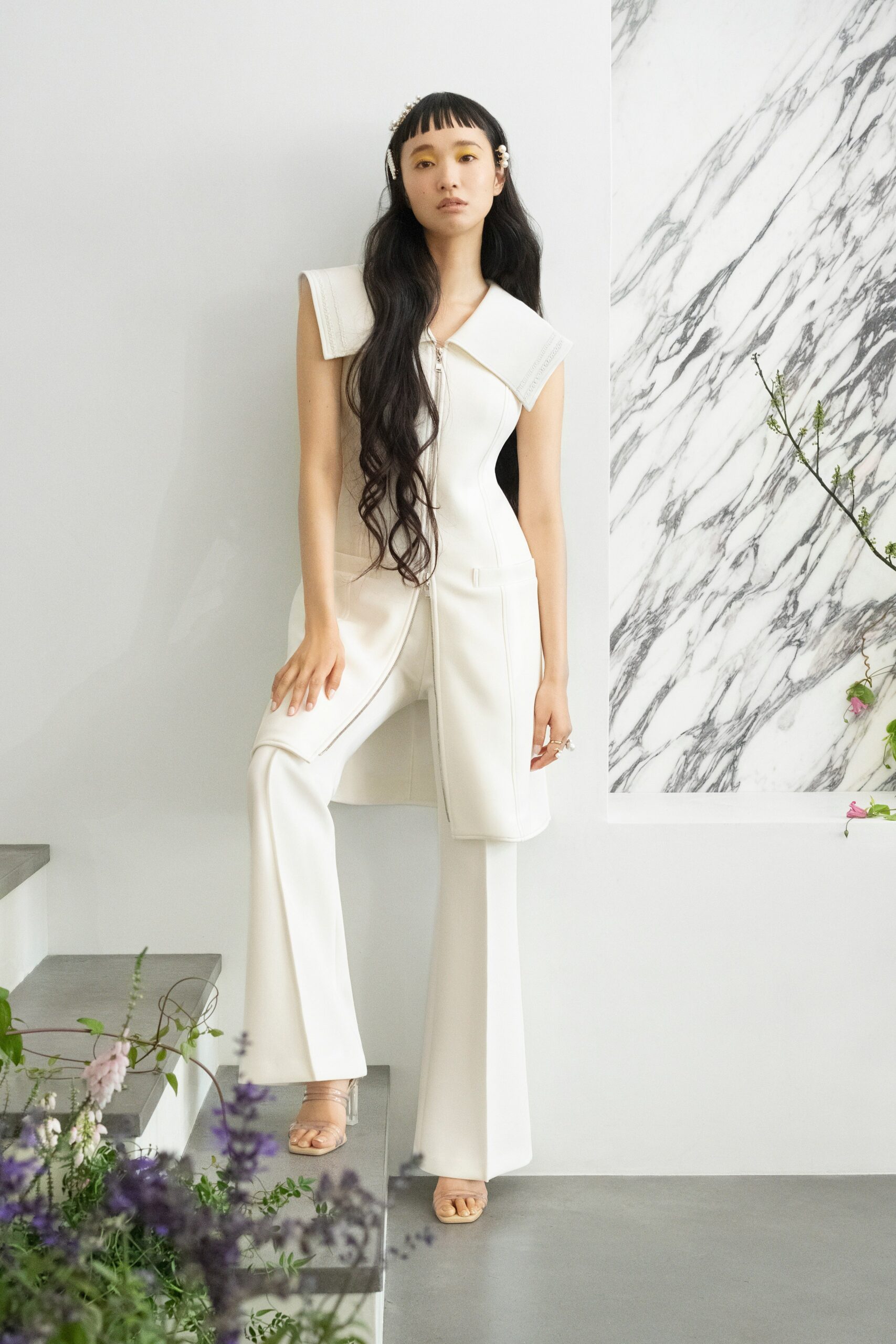 white fitted jumpsuit with wide-leg pants