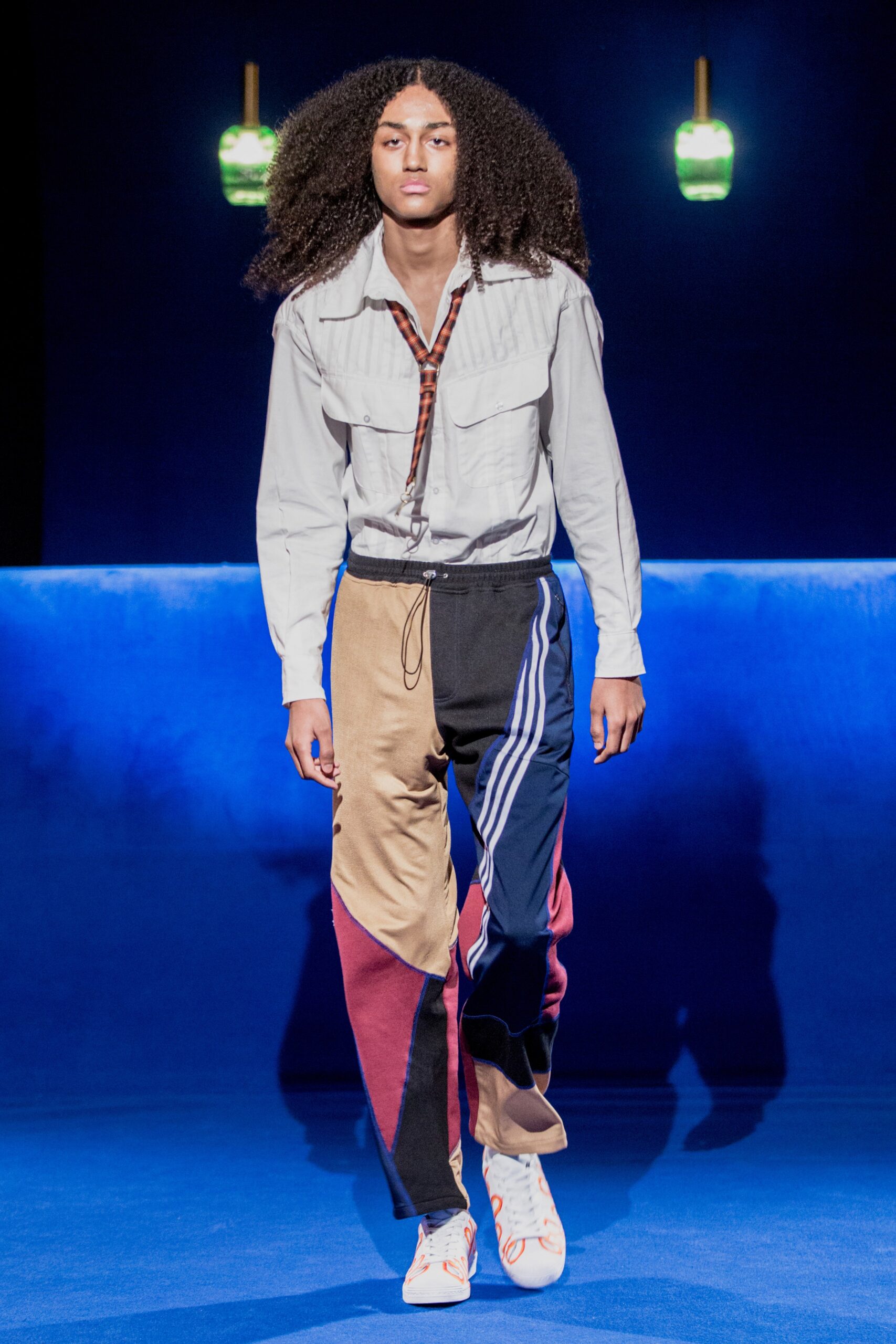 relaxed white shirt with color-blocked pants