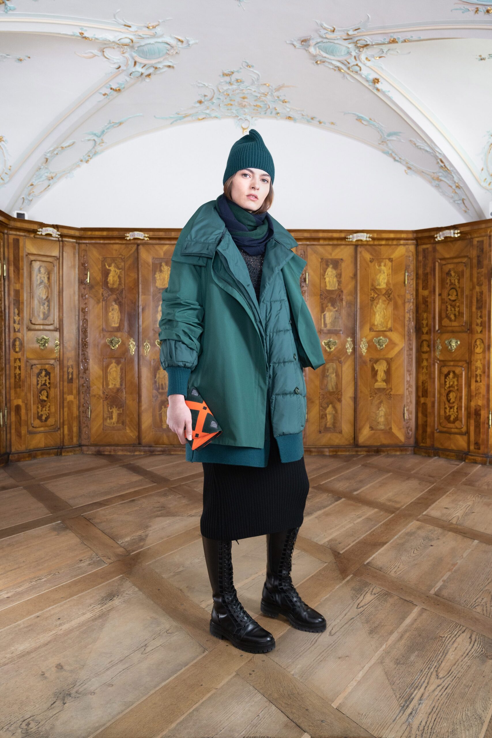 green oversized coat with black dress