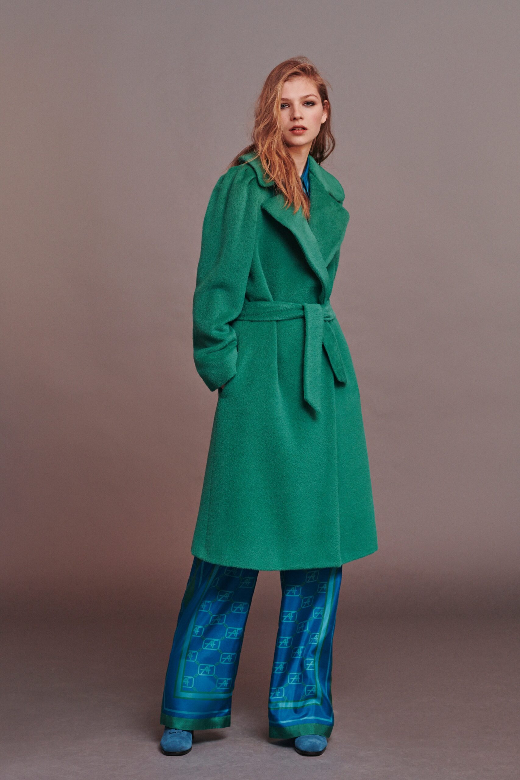 green wool belted coat and blue silk pants