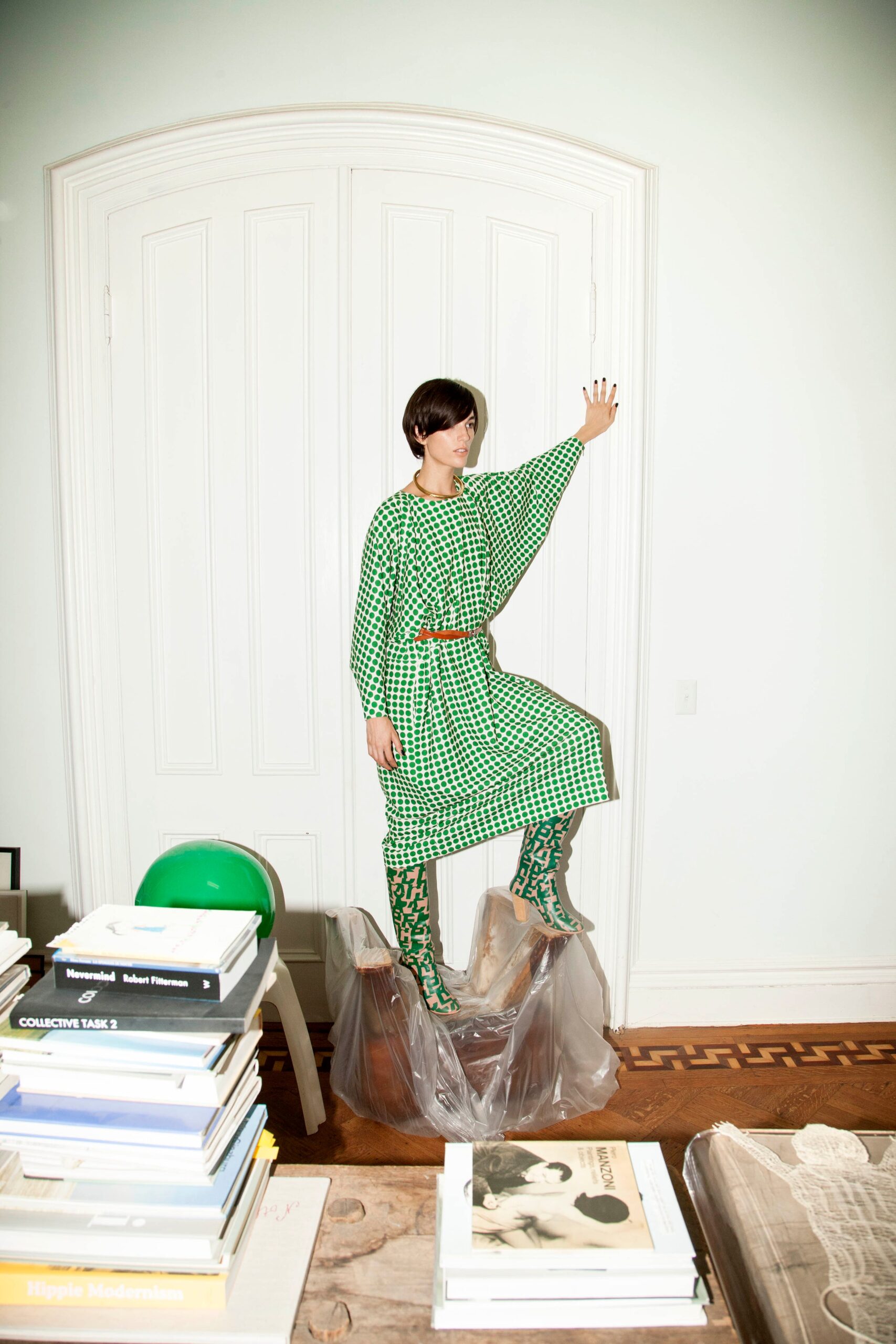 A relaxed green checked dress with long sleeves and a collared neckline.