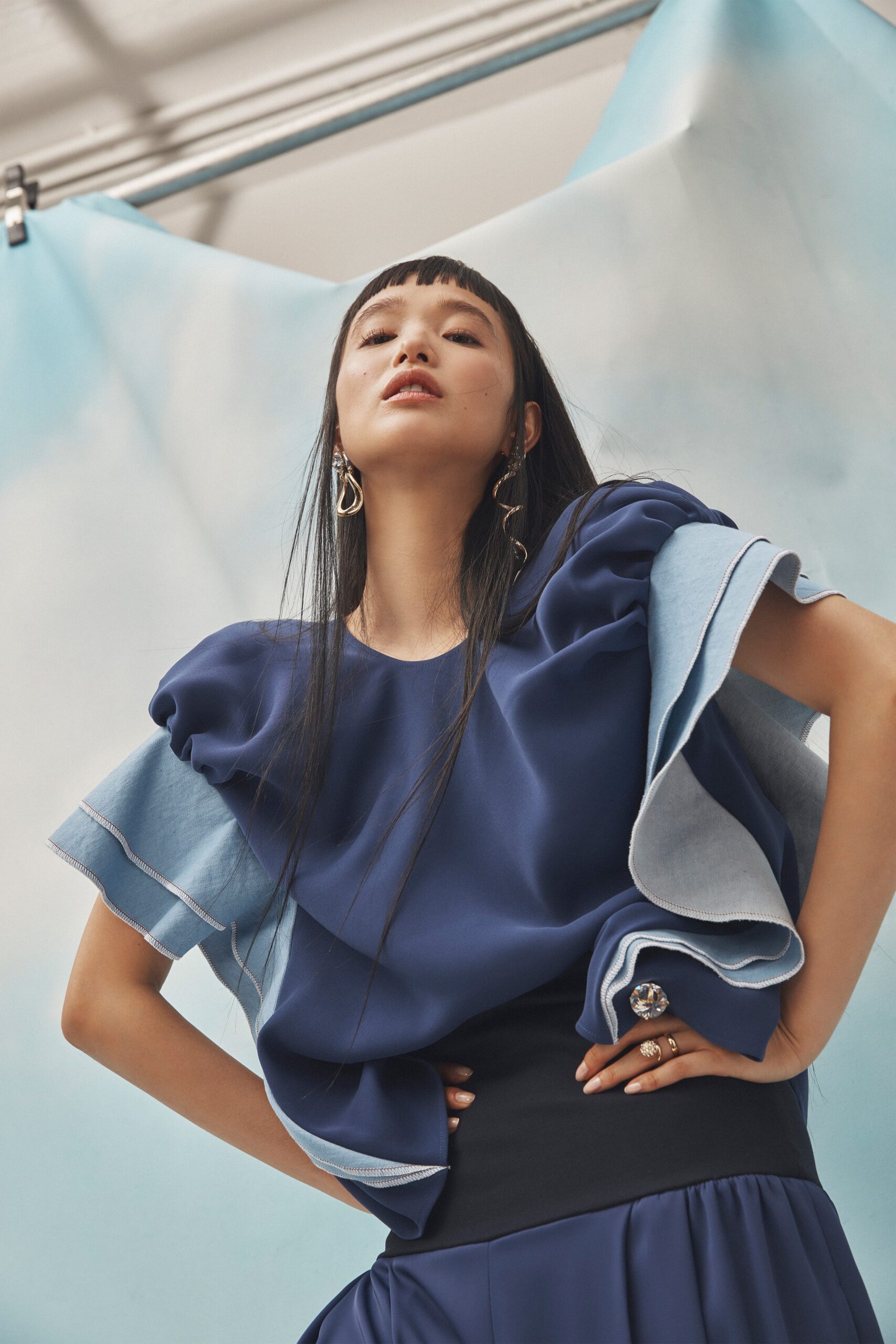 blue ruffled top with pleated skirt