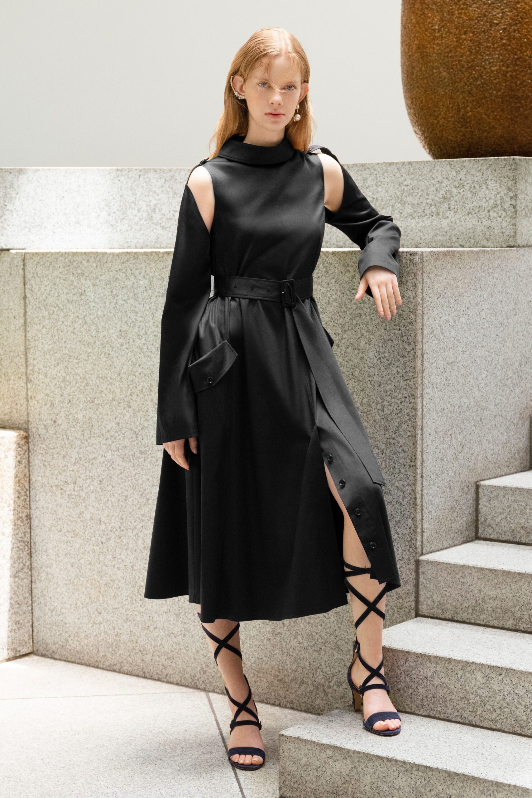 black fitted midi dress with strappy shoes
