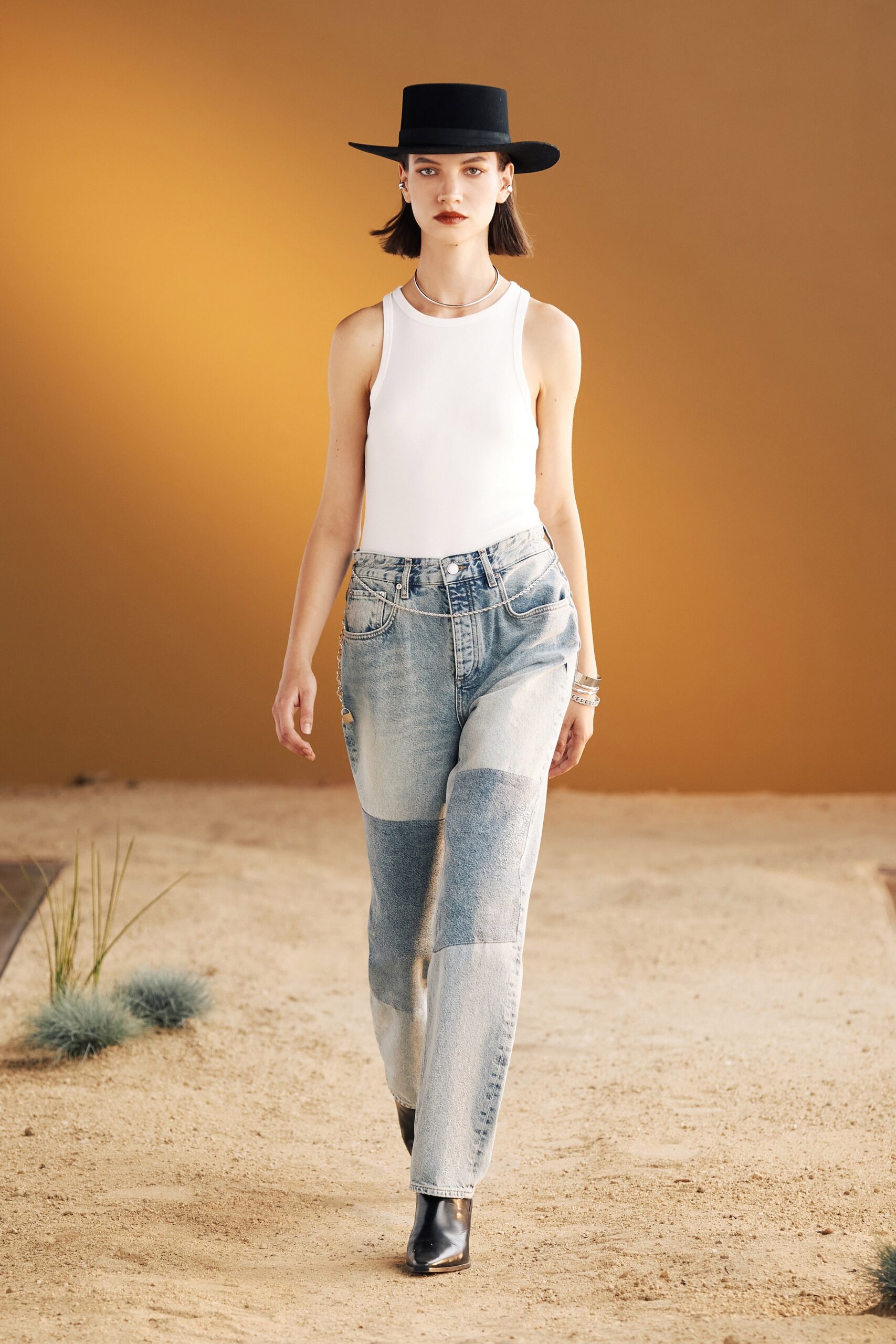 white tank-top with patchwork jeans