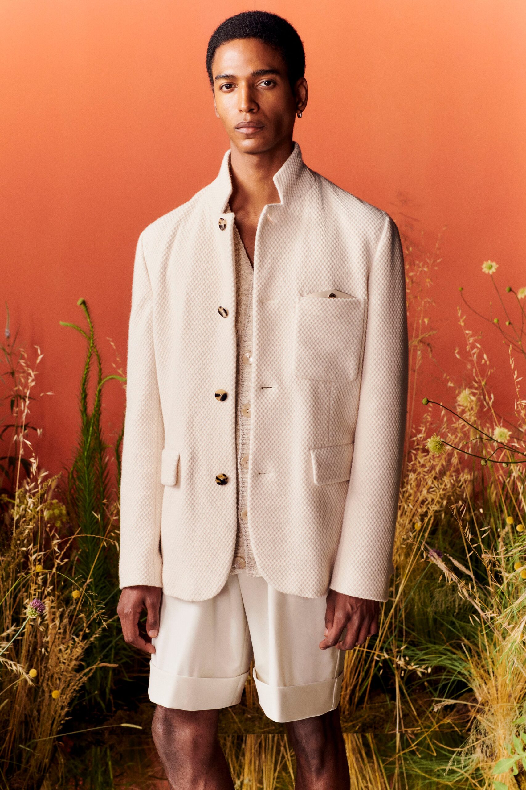 beige relaxed jacket and white shorts