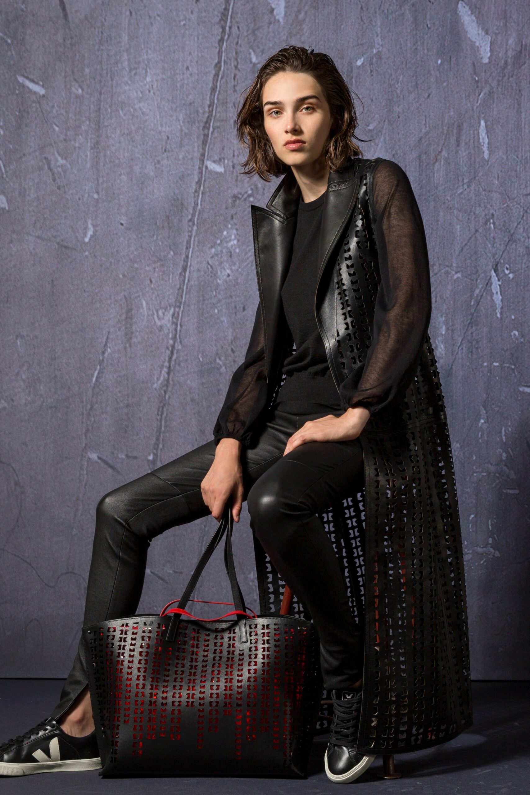 black leather long-sleeve collared fitted layered zippered coat
