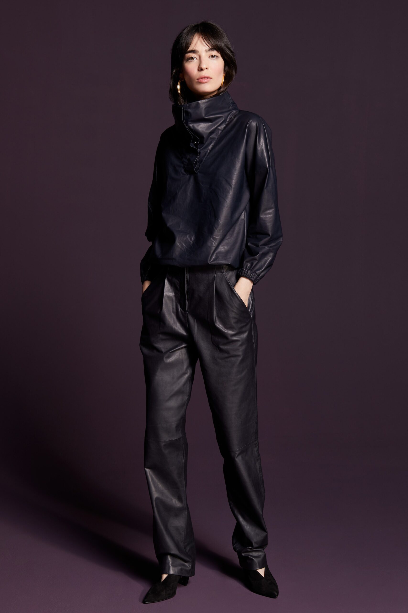 black leather relaxed top and fitted pants