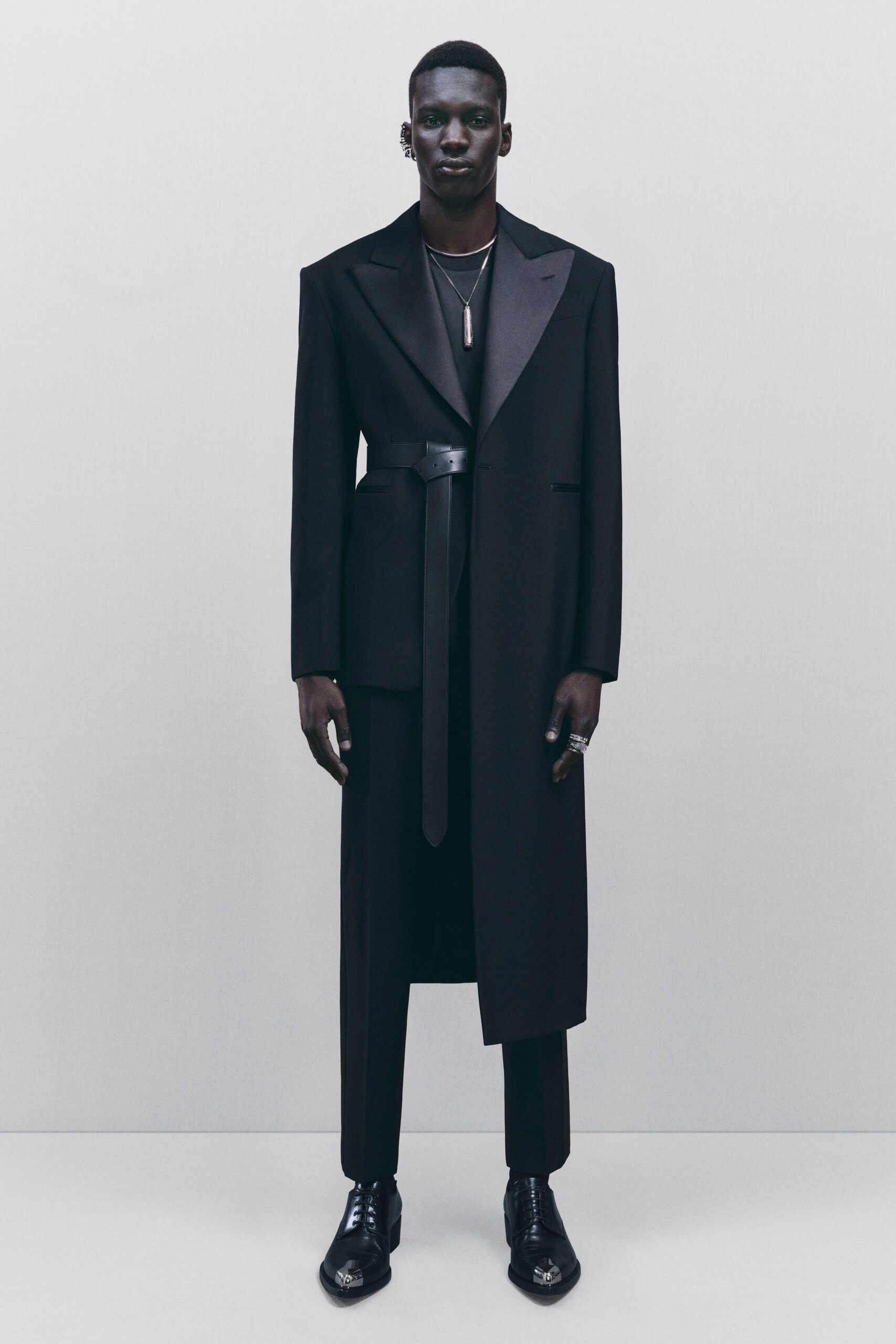 black tailored coat and pants