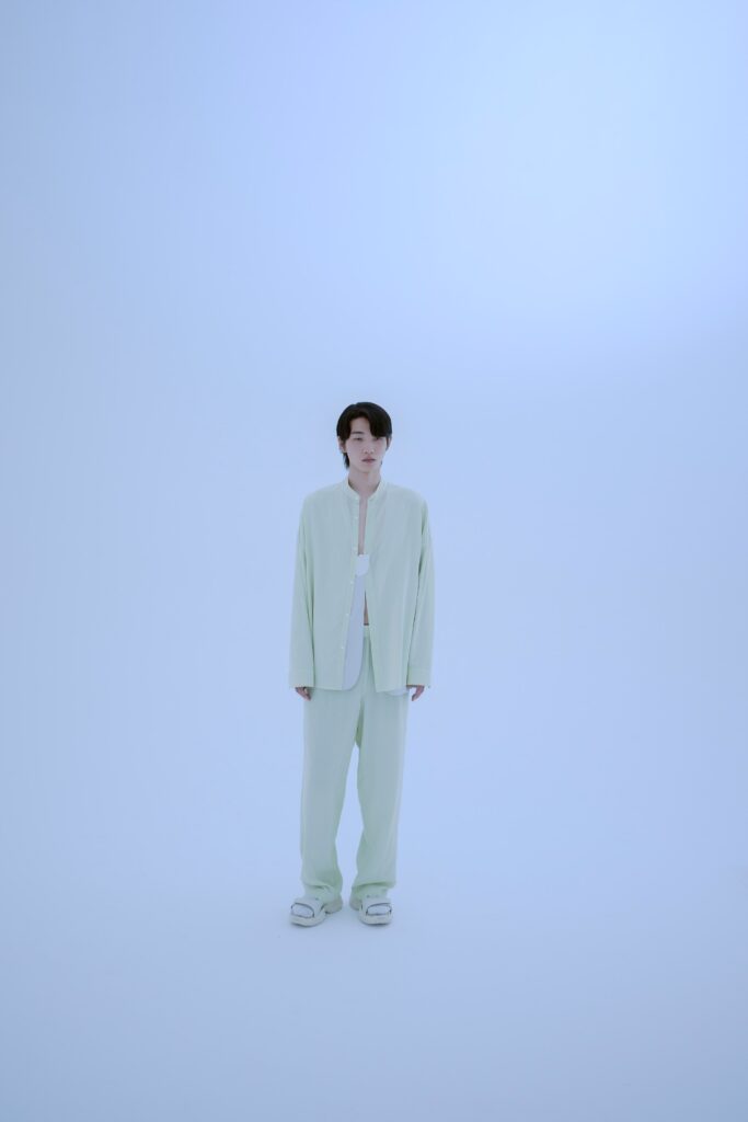 A relaxed green long-sleeve collared shirt paired with matching straight-leg pants.