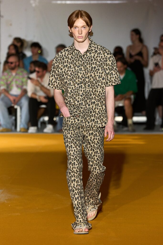A relaxed brown animal-print shirt with short sleeves and matching pants.