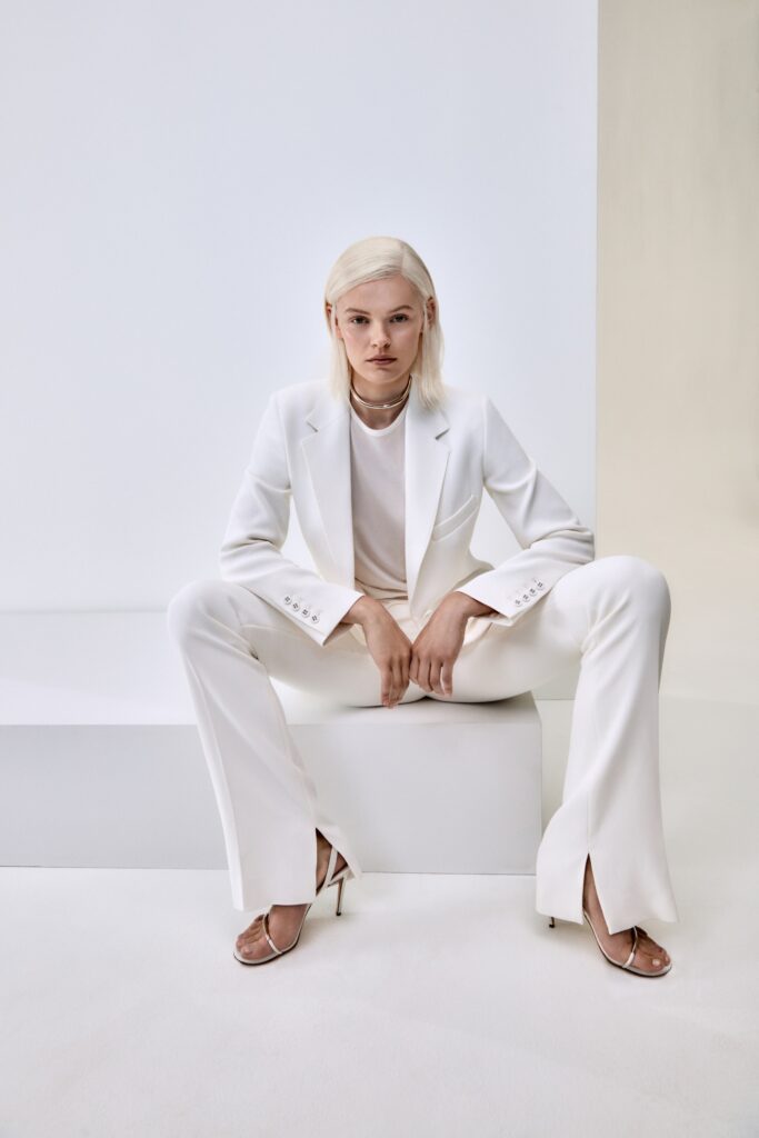 white tailored suit with clear shoes
