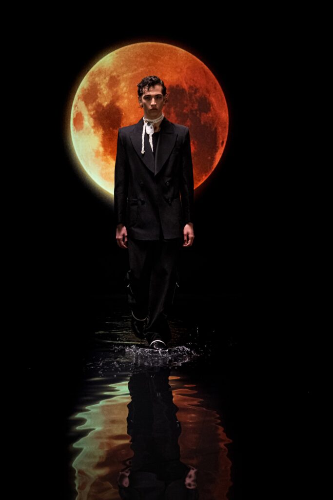 black tailored suit with scarf