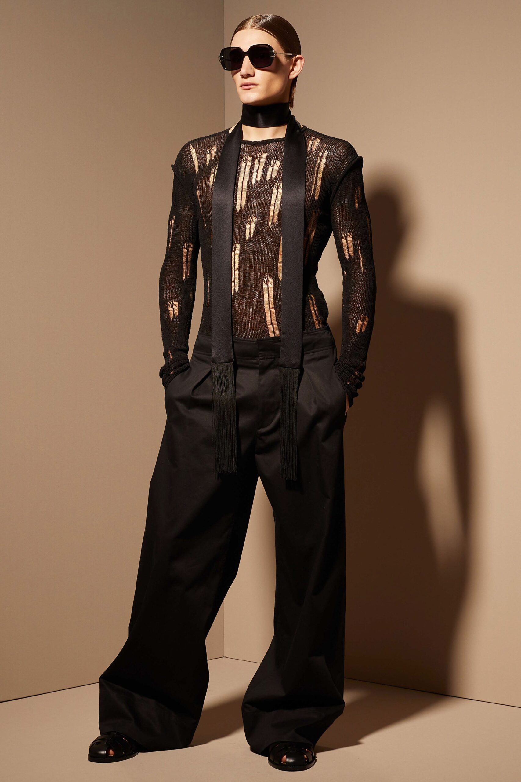 black mesh top and relaxed pants