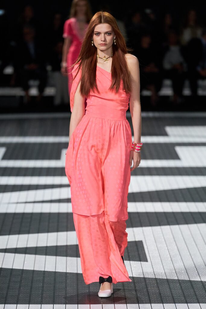 A relaxed pink silk sleeveless dress with a V-neckline and maxi length.