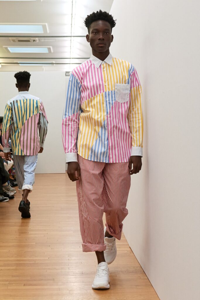 A relaxed fit long-sleeve collared shirt with stripes paired with relaxed striped pants.