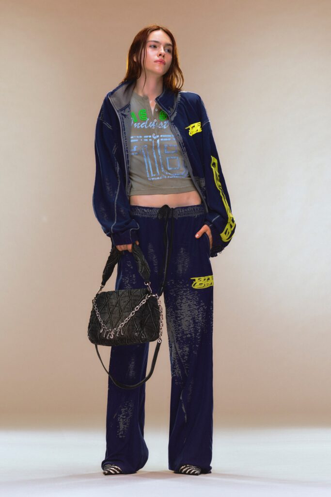 A relaxed blue cotton jacket with long sleeves and matching pants featuring a printed design.