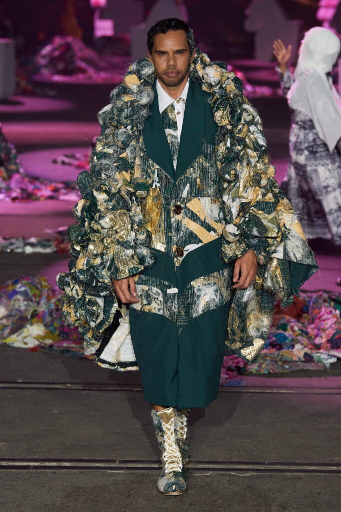 A relaxed multicolor coat with a layered design, paired with matching pants.