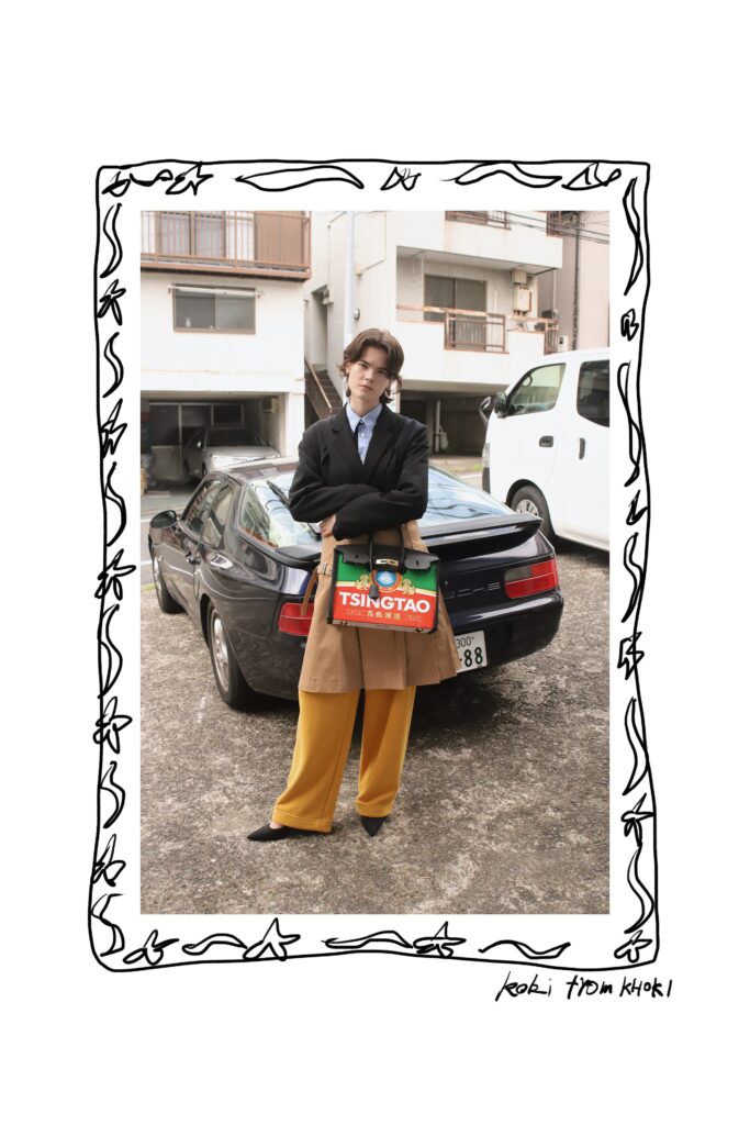 An oversized black blazer paired with tailored yellow pants for a chic, modern look.