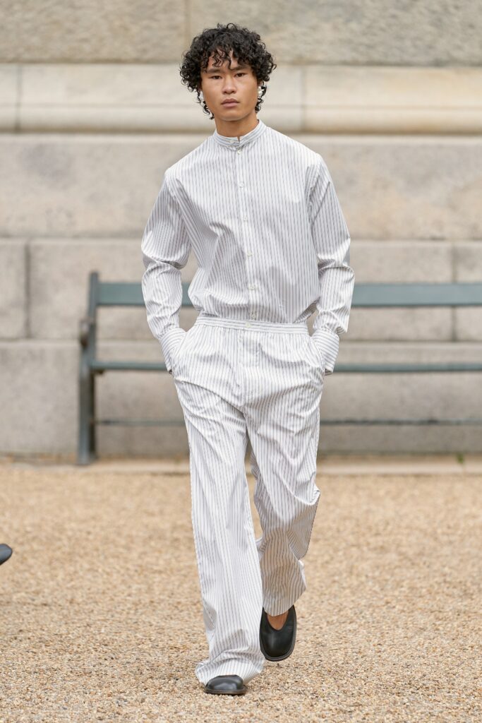 A relaxed fit white and gray striped long-sleeve shirt paired with matching pants.
