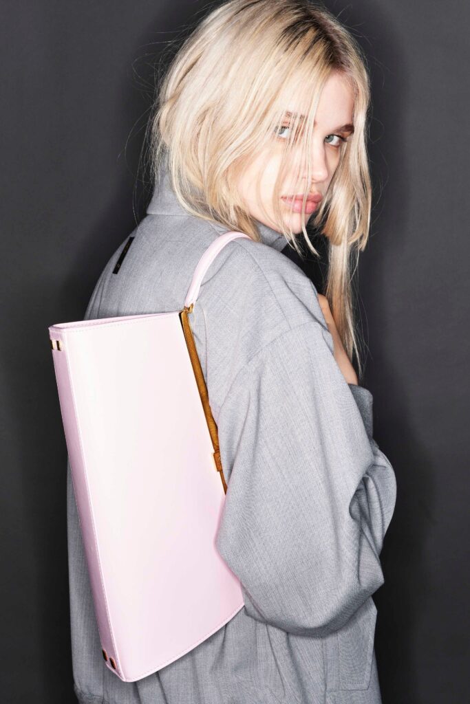 An oversized gray cotton jacket with long sleeves and a collared design.