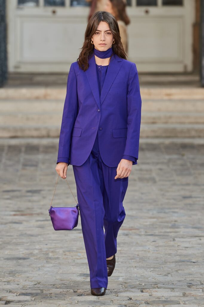 purple tailored suit with bag