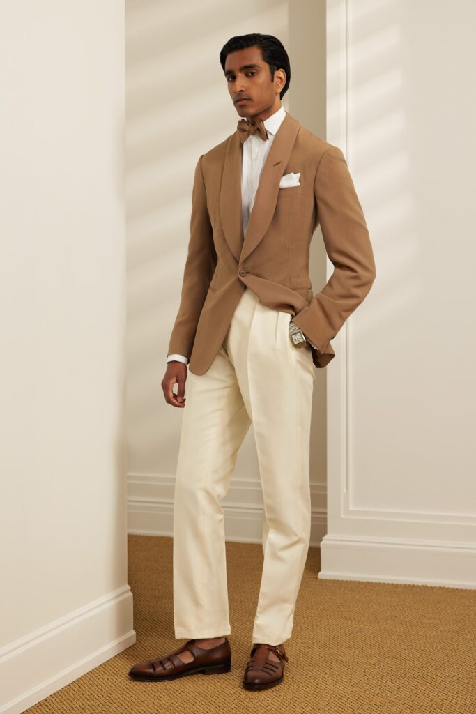 A tailored beige blazer paired with white straight-leg pants for a sophisticated look.