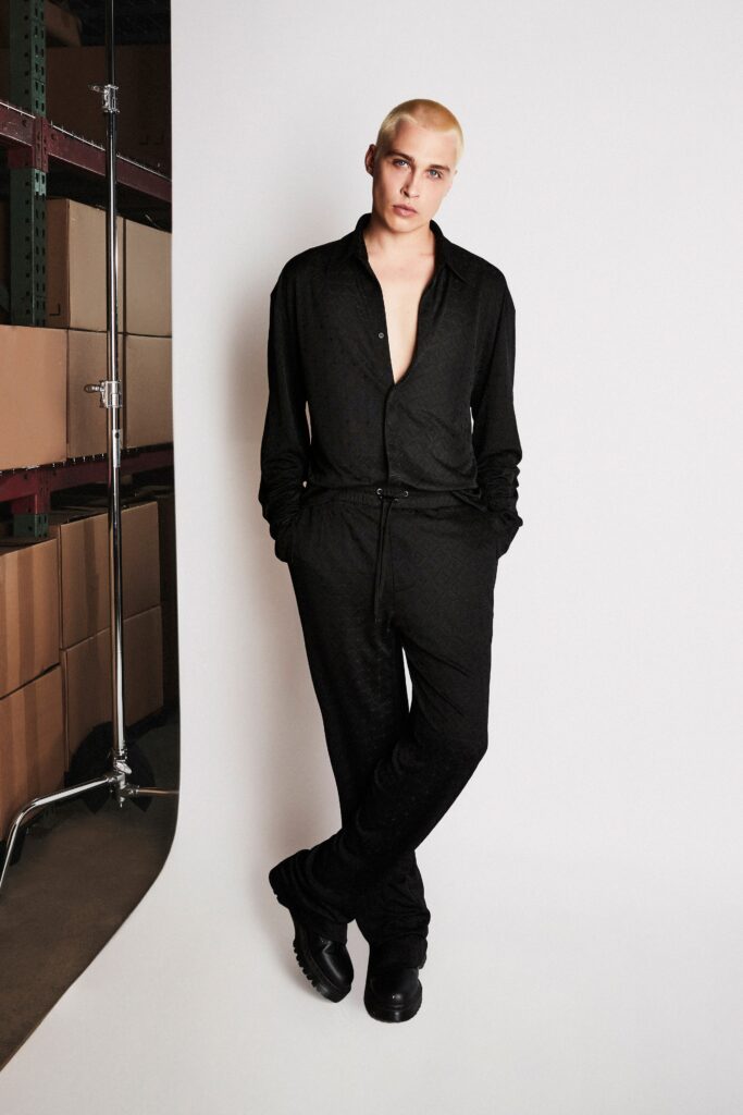 A relaxed black long-sleeve shirt with a collared neckline paired with matching pants.