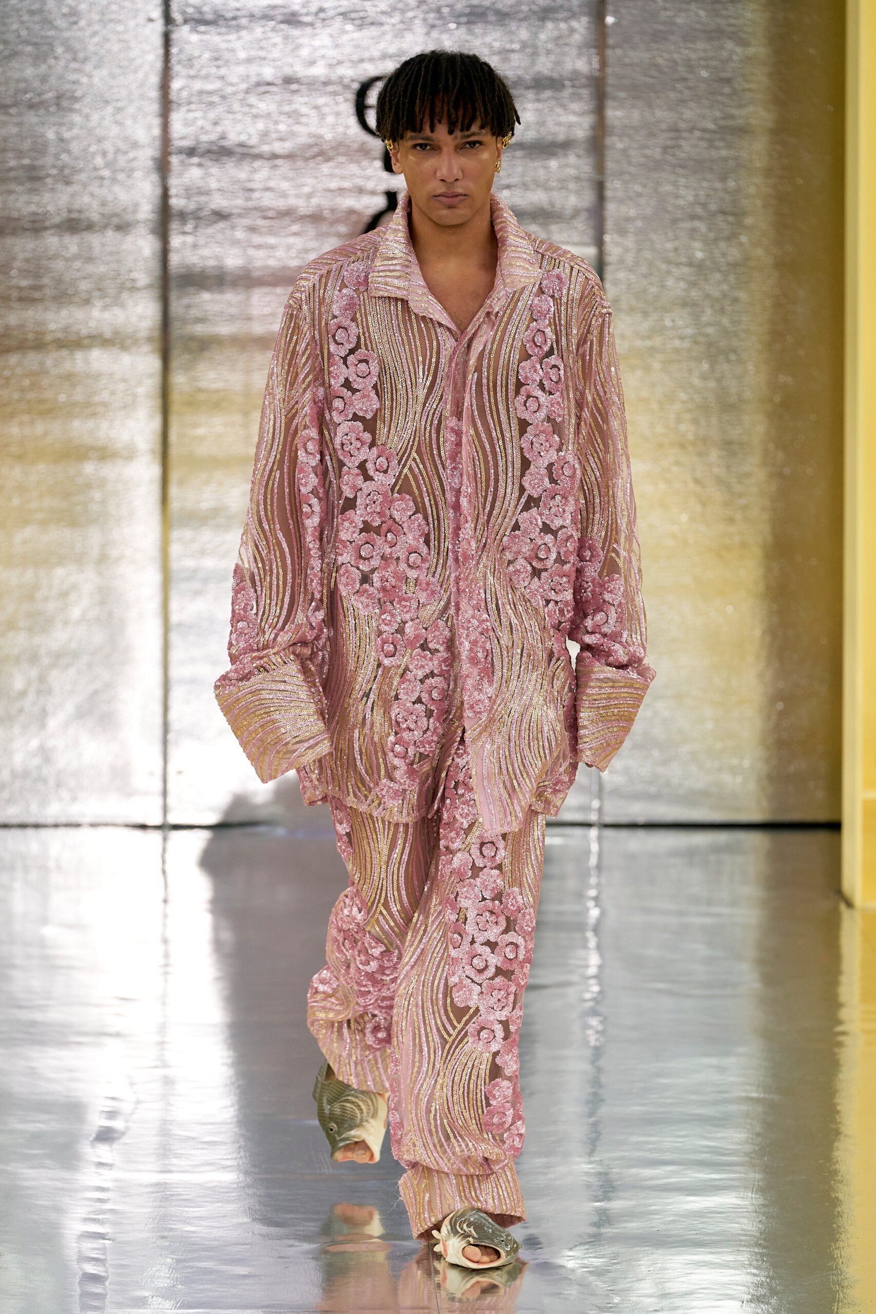 A relaxed fit pink silk shirt and pants with long sleeves and intricate embroidery.