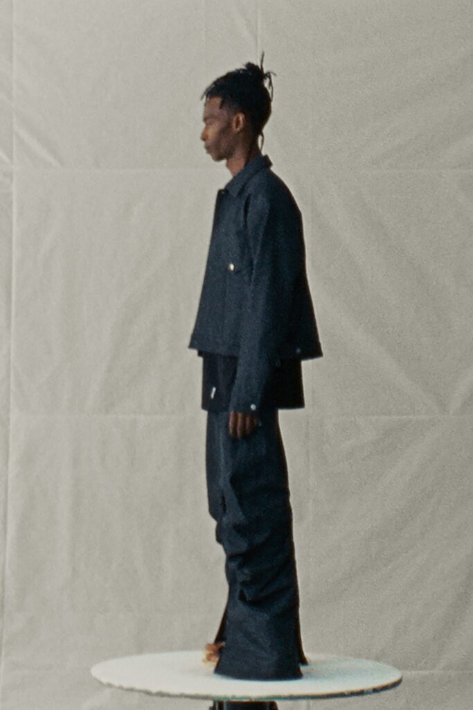 A relaxed blue denim jacket with long sleeves and asymmetric pants.