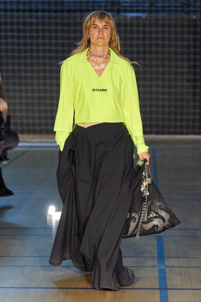 neon green mesh top and black flared skirt