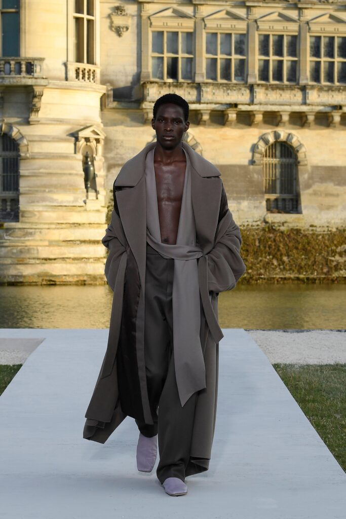 beige wool relaxed coat and gray tailored pants