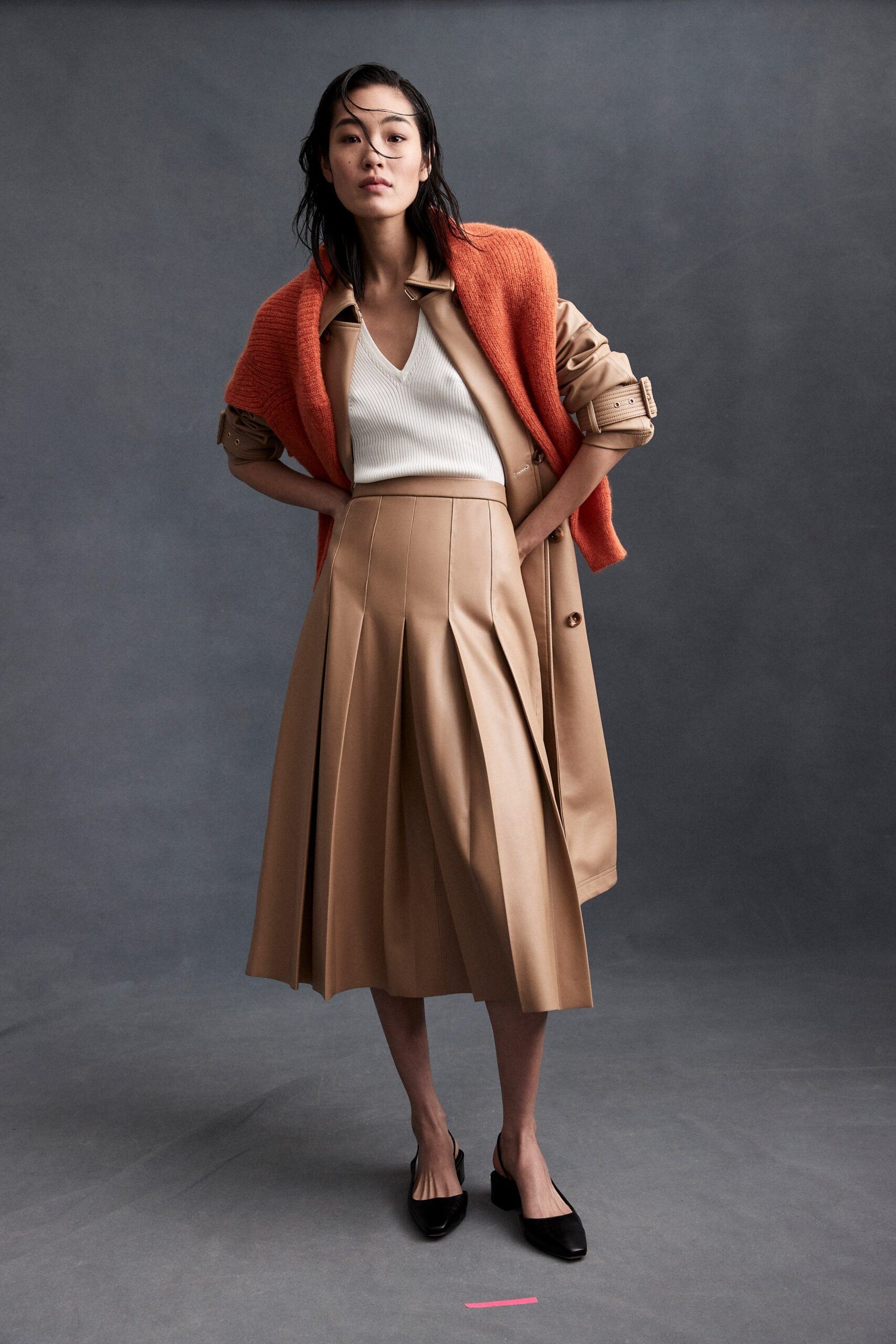 beige coat white top pleated skirt