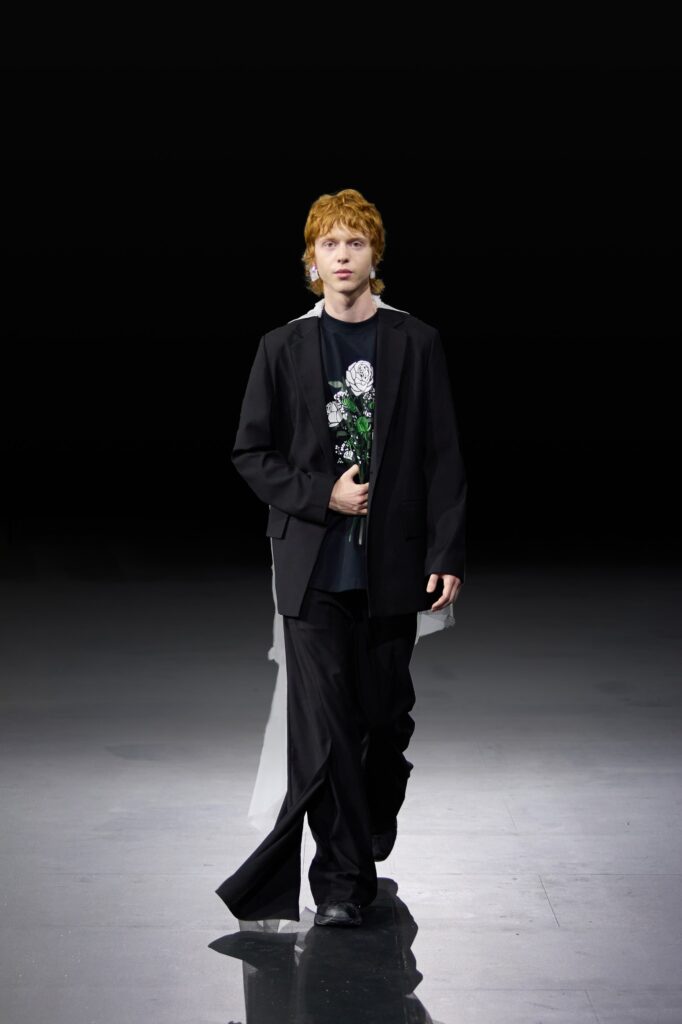 An oversized black blazer paired with tailored black pants for a chic runway look.