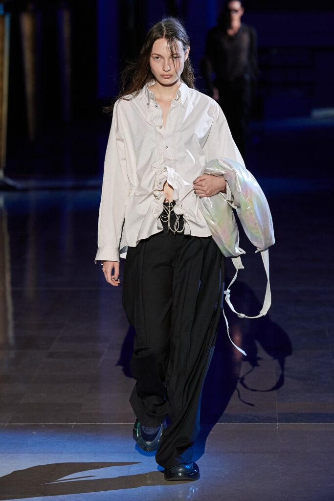 white relaxed shirt black pants