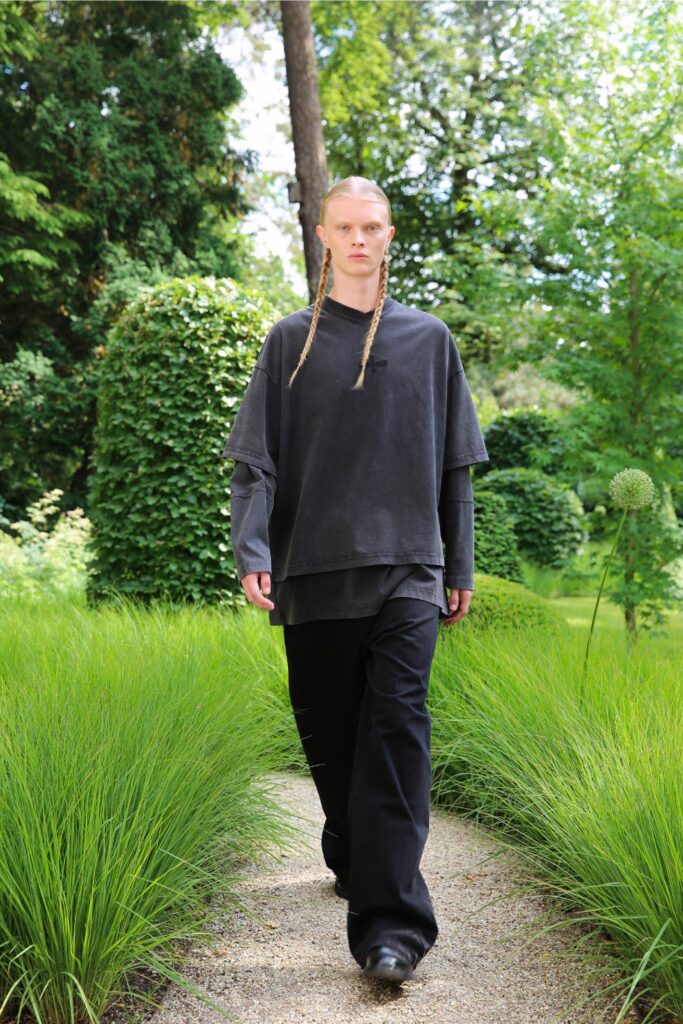 A relaxed black cotton top with short sleeves paired with matching relaxed pants.