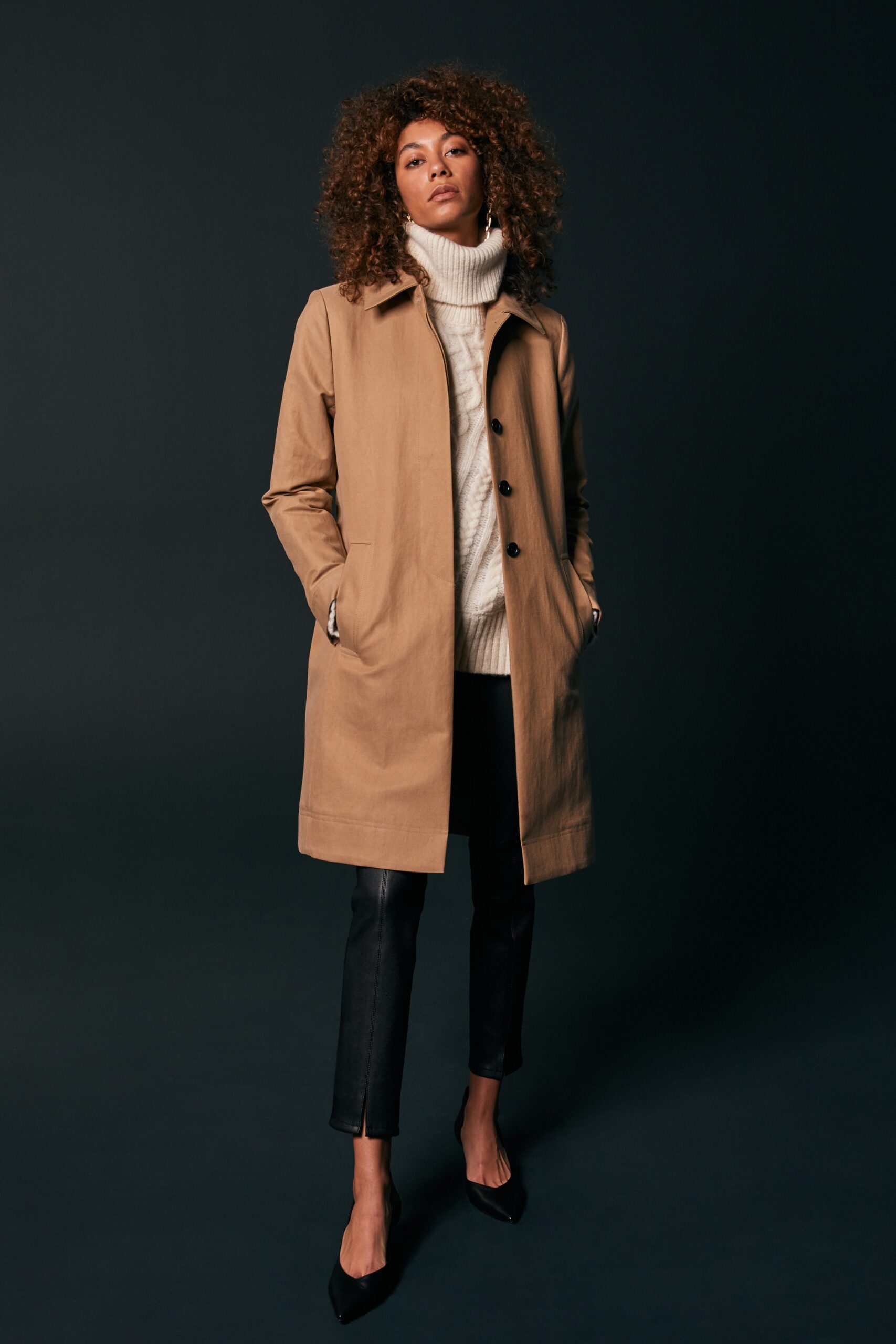 beige coat with white sweater