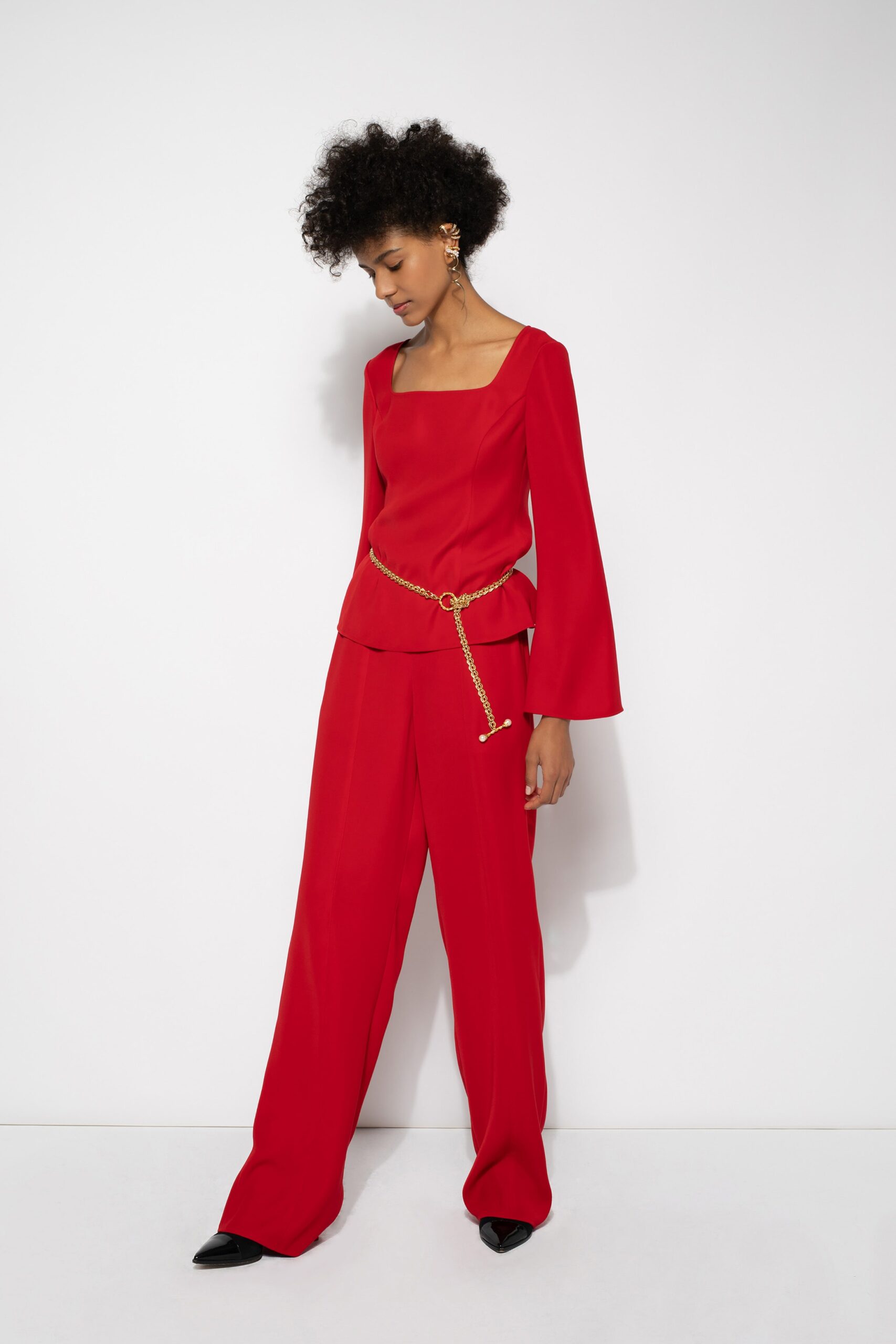 red fitted top and relaxed pants