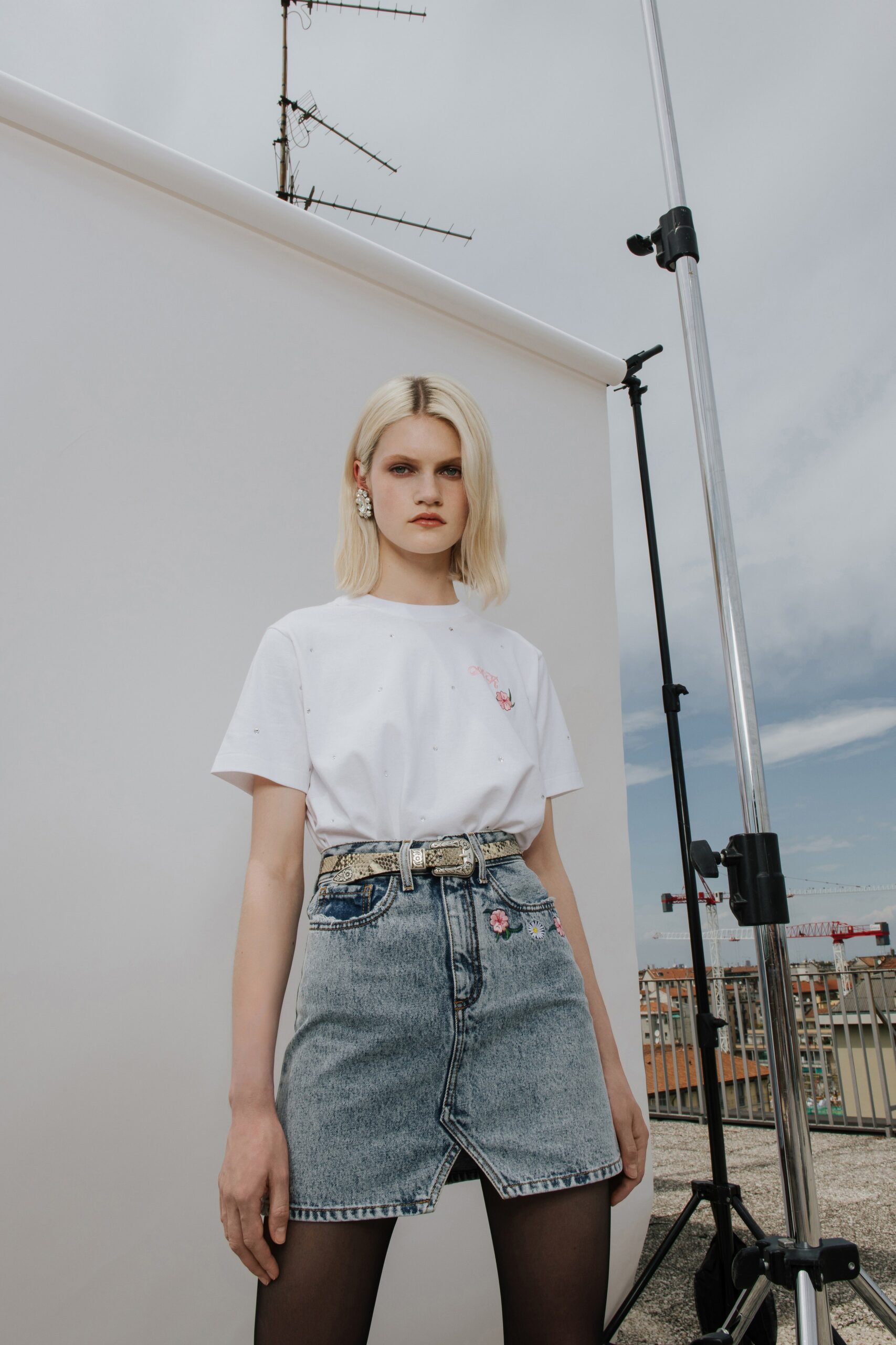 white cotton t-shirt and blue denim skirt