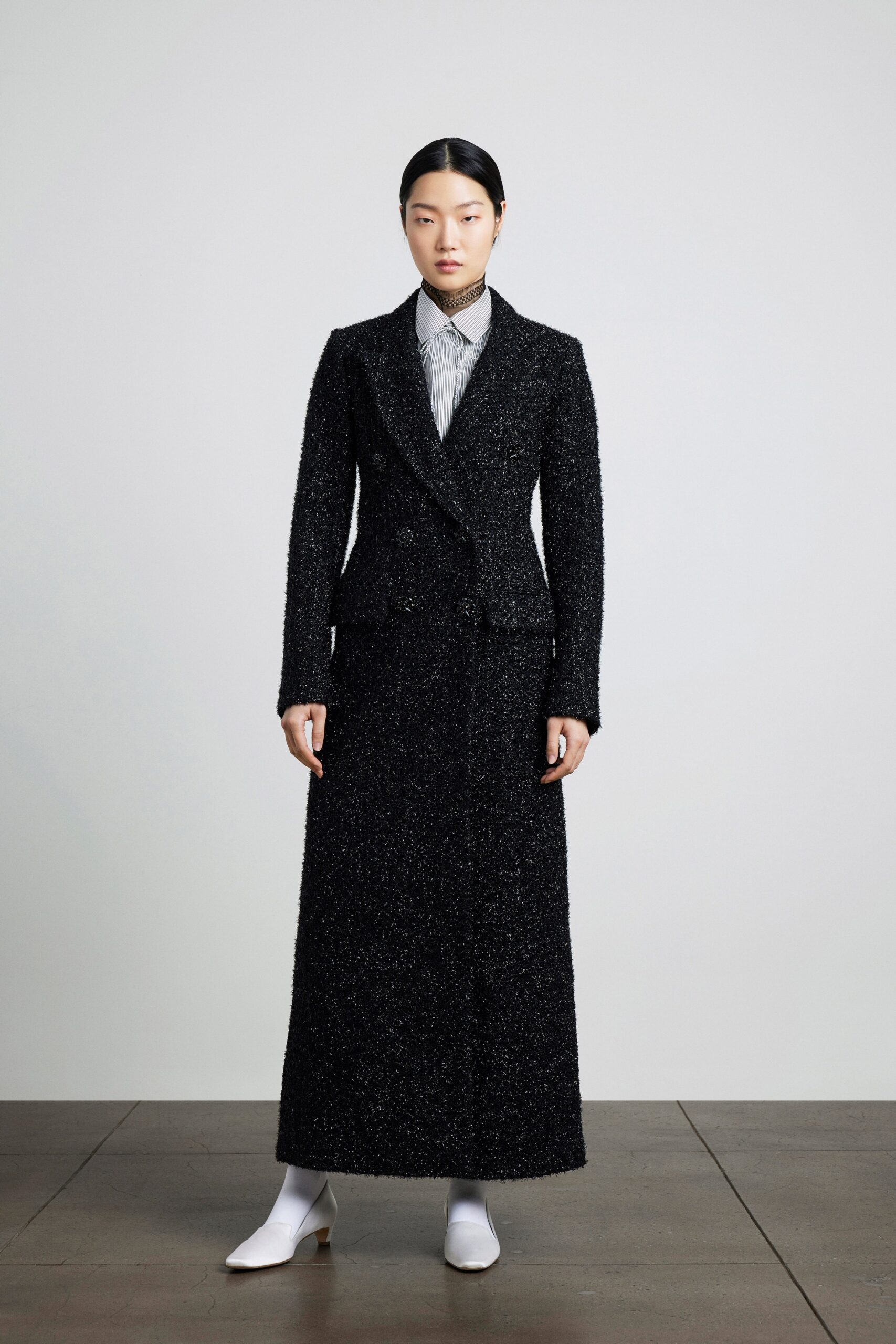 black tweed coat with striped shirt