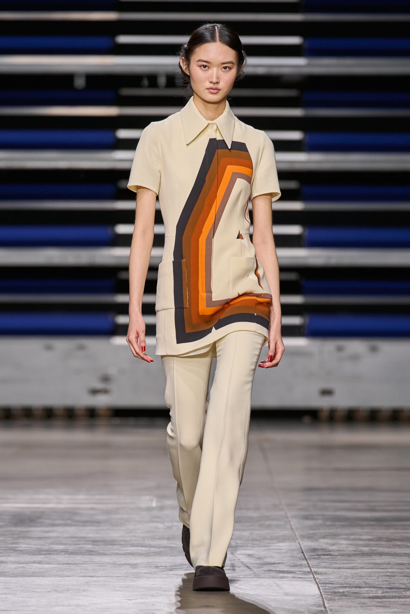 beige color-blocked top with fitted pants