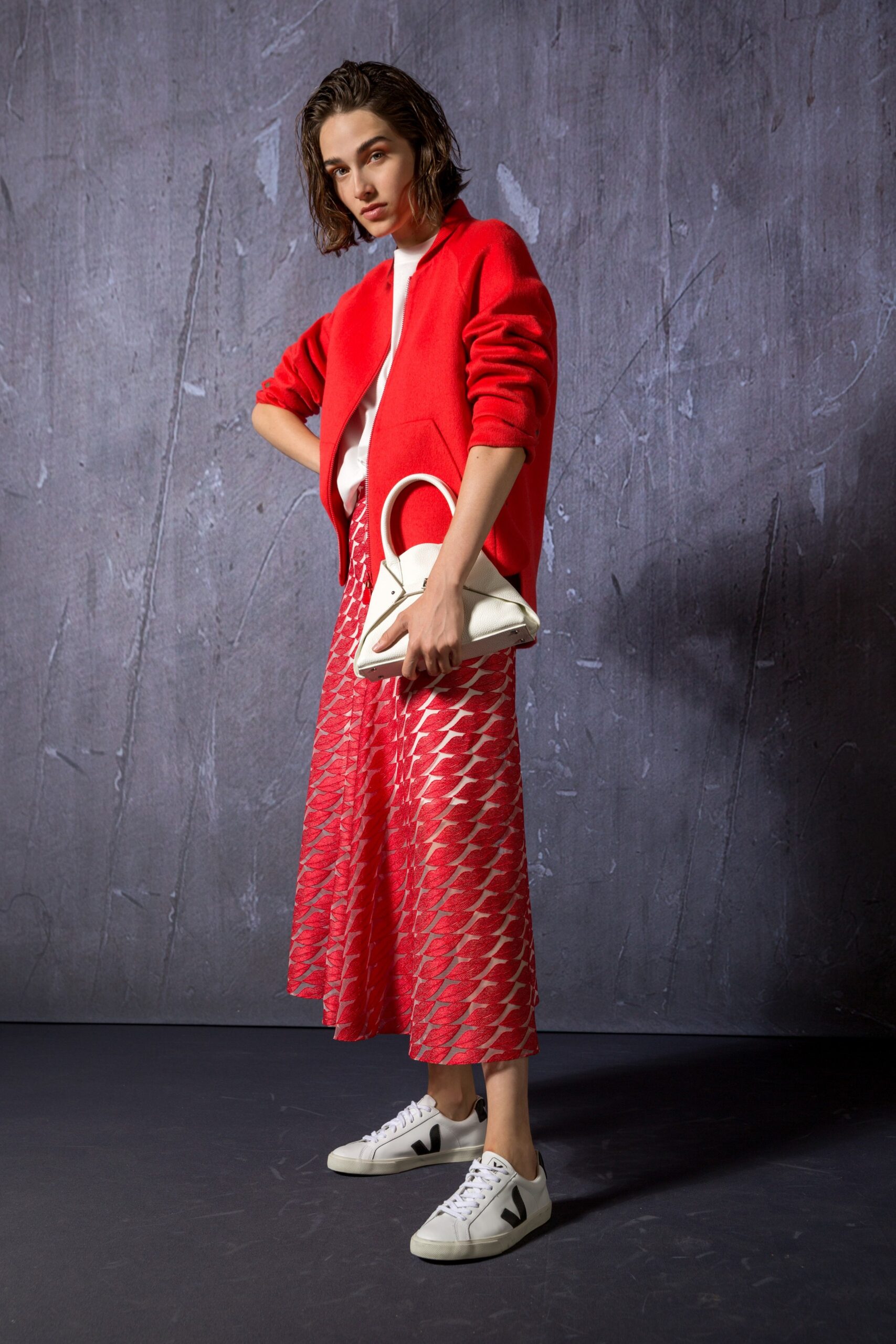 red cardigan pink pleated skirt