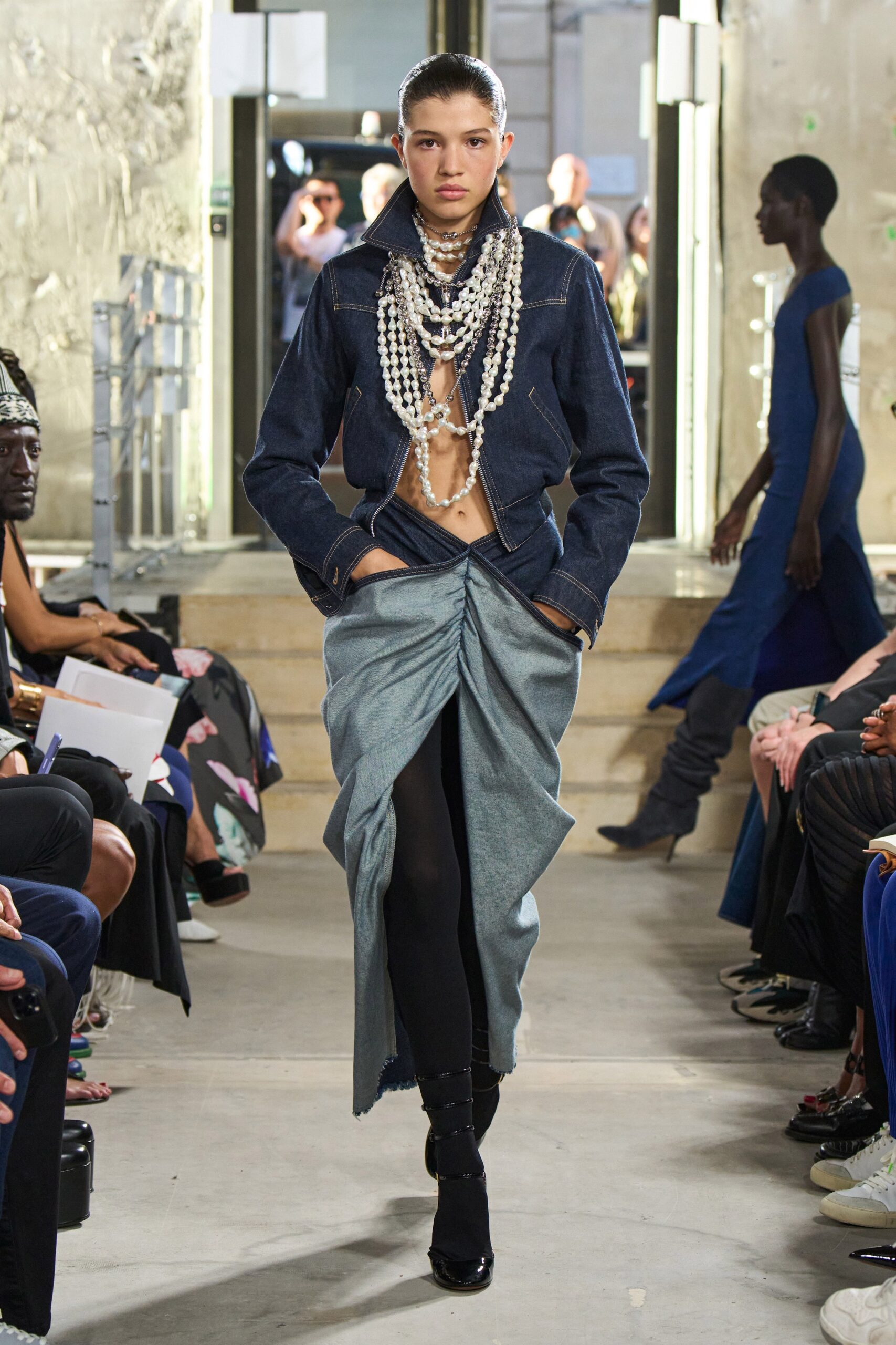 blue denim jacket and gray skirt