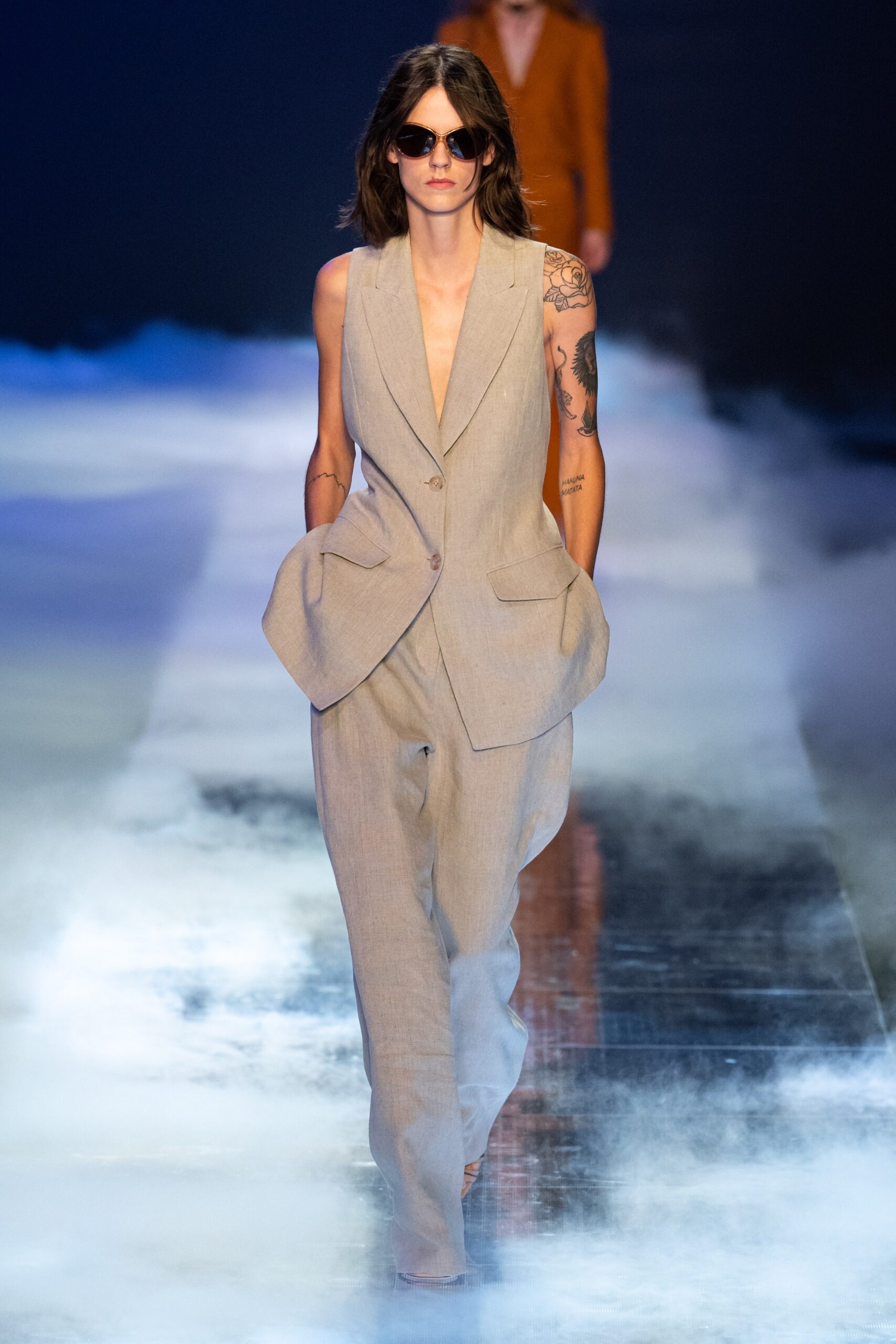 beige tailored sleeveless suit
