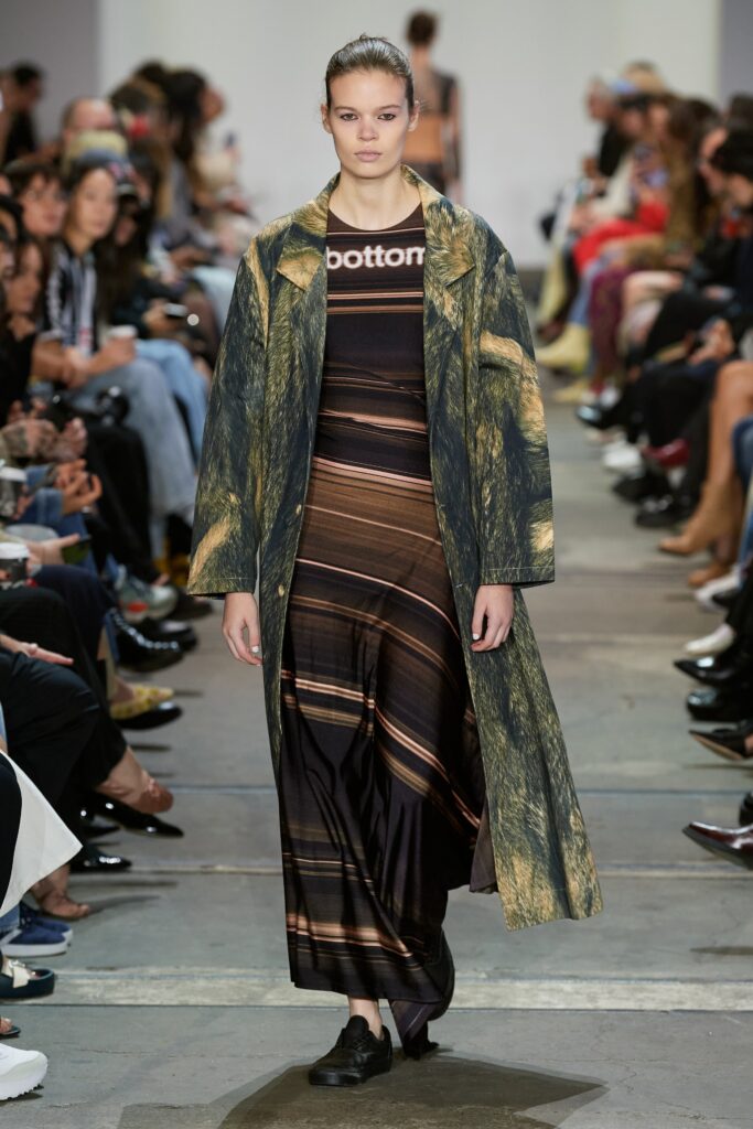 A relaxed multicolor dress layered with a long-sleeve coat featuring a collared design.