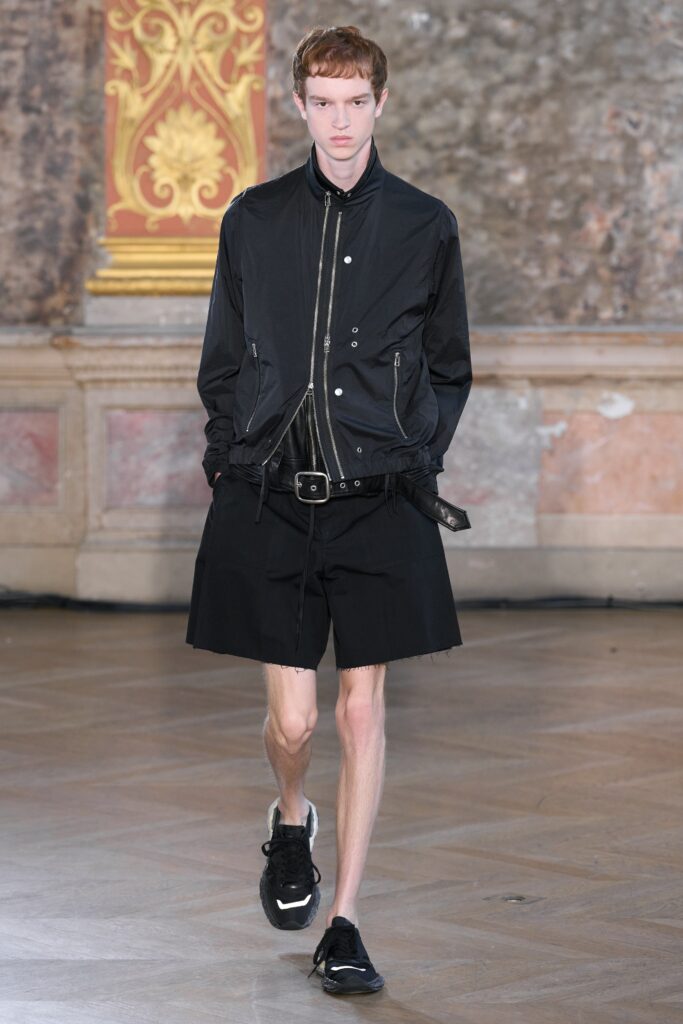 black fitted jacket with relaxed shorts