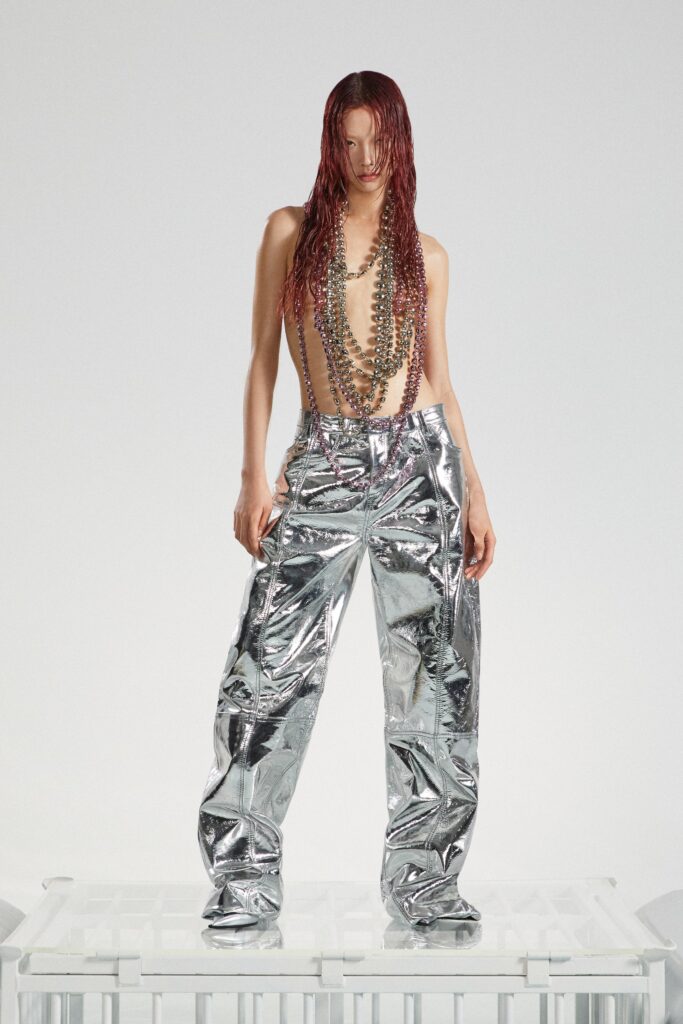 A pair of relaxed silver metallic pants with a wide-leg design and sleeveless top.